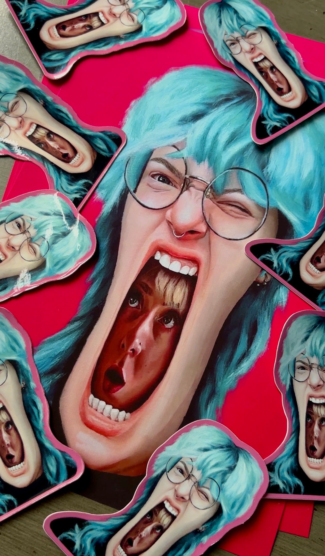 Art Print of a person with blue hair and glasses, surrounded by small sticker versions of themselves on a red background.