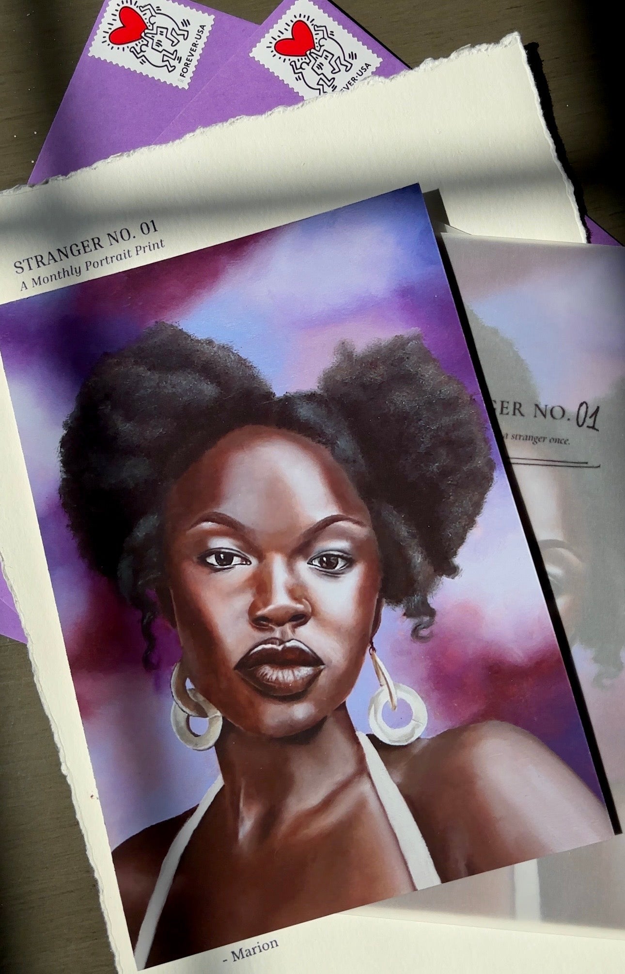 Artistic depiction of a woman with styled hair on a purple background, surrounded by promotional materials.